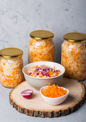 Sauerkraut in a glass jars and plate.  The best natural probiotic. Fermented product 