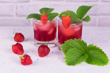 Refreshing drink made from fresh strawberries on a white background.