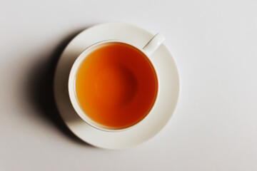 cup of tea on white background.White cup with a tea isolated on a white background.top view.