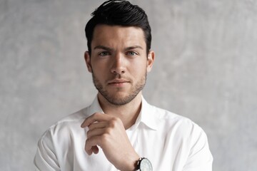 Handsome man wear blue suit isolated on grey background