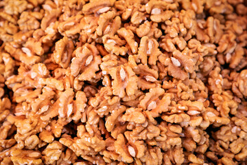 Full frame of shelled organic walnuts. Background of walnuts (Selective focus)