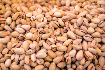Pistachio nuts backdrop. Full frame shot of pistachios (Selective focus)