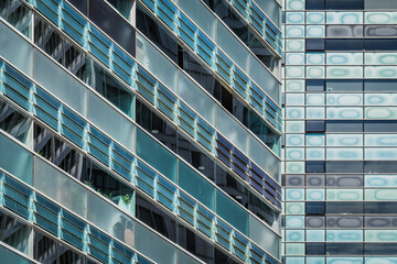 Glazed facades of two urban buildings