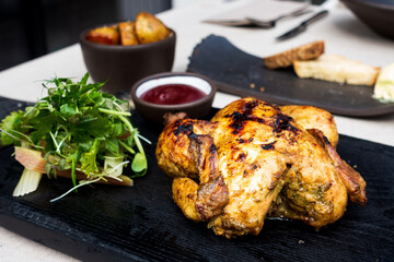 Roasted sleeves chicken with potatoes and barbecue sauce