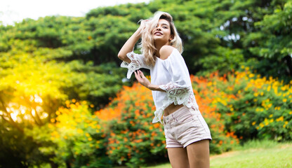 Obraz premium Freedome Happy young beautiful Woman Enjoying life at Nature park concept.