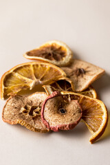 Subtle Fruit Chips Orangand Apple Chips on Yellow Background Close Up Vertical