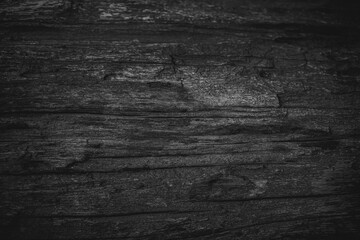 Naklejka premium Vintage background image of the old gray wooden has a rough texture and different grain patterns. There are straight and curved lines. There are vignettes and the middle of the image for copy space.