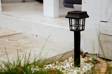 Solar-powered garden lamp in the daytime. Renewable eco energy in domestic life