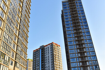 Obraz premium Construction of skeleton of modern residential buildings. Erection multi-storey building. Mineral wool insulation facade. Thermal protection of house. Preparing to pour of concrete into formwork