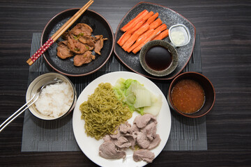 Asian oriental food composition, served on dark rustic background, top view. Thai cuisine set, japanese, chinese, korean.