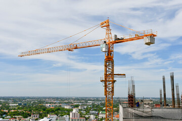 Fototapeta na wymiar The Crane tower in construction site of a high-rise condominium.