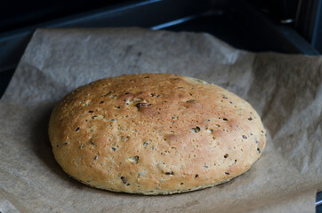 Milk bread on the yeast at home in red form on the board