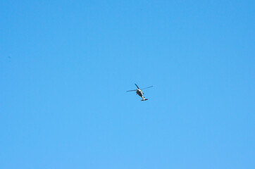 helicopter flying on blue sky