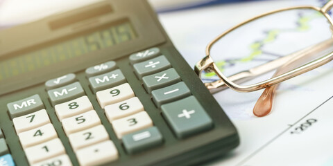 solar powered calculator screen with numbers and glasses