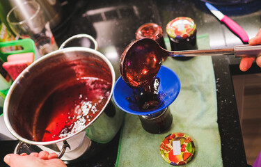 Senior woman prepare glasses with self made jam - Passion and natural food