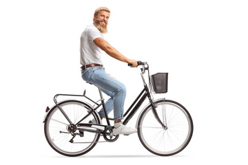 Bearded guy with moustaches riding a bicycle and smiling at camera