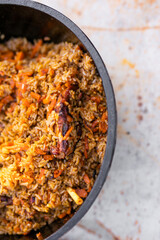Preparation of raditional armenian pilaf in a cauldron on an open fire