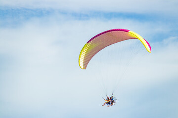 paraglider flight on sun and sea beach