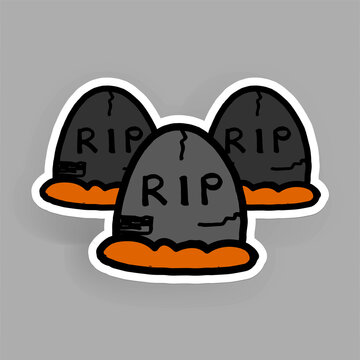 three gray tombstones with orange base