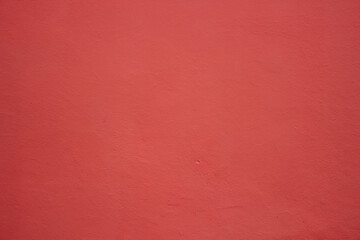 Red plaster stucco texture wall background 