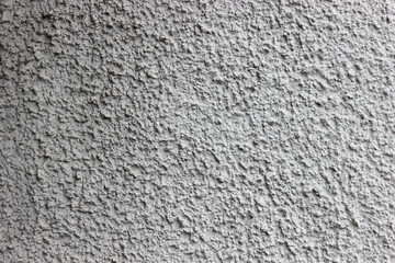 Very rough grey plaster work detailed close up wall background texture