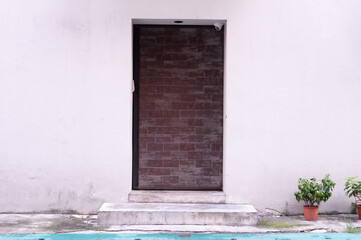 sidewalk by street wall & door