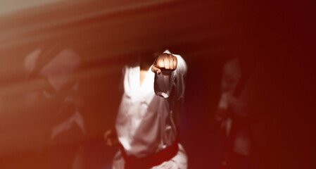 Taekwondo martial art sport banner background with copy space, athlete punch hitting on camera front view detail
