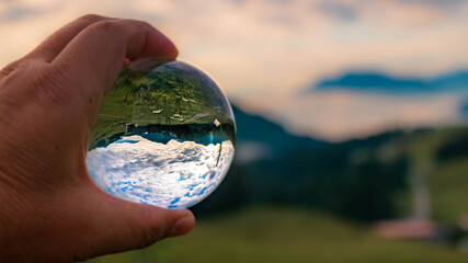 Crystal ball alpine landscape shot at the famous Spitzingsee, Bavaria, Germany