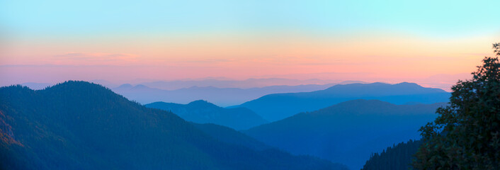 Beautiful landscape with cascade blue mountains at the morning - View of wilderness mountains during foggy weather