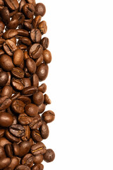Roasted coffee beans background. Roasted seeds on white background. Copy space 