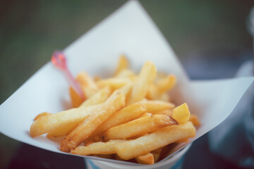 Full of fresh french fries on paper bowl