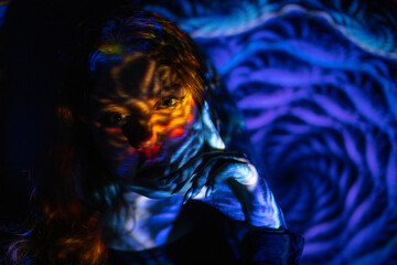 Girl in colored neon light 