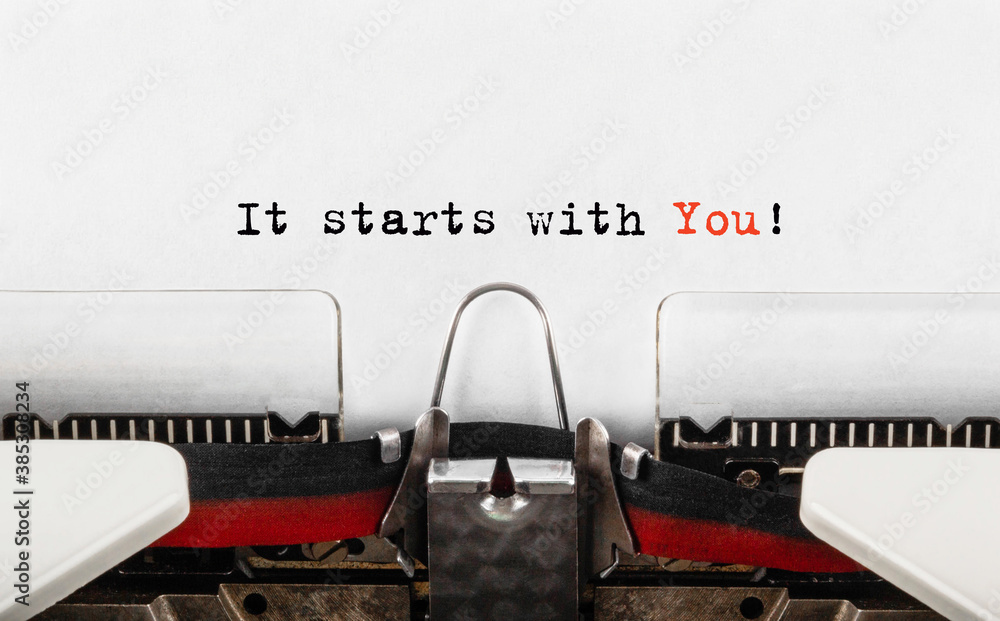 Fototapete text it starts with you typed on retro typewriter