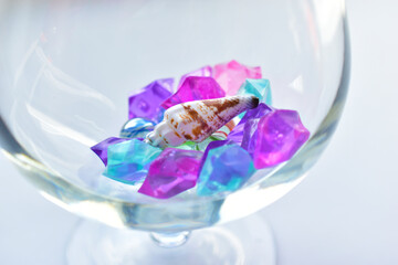 Colorful crystals and balls in a glass glass