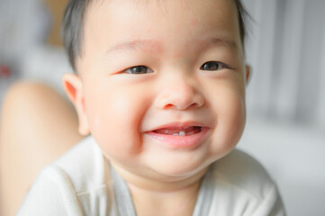 11 months baby boy portrait, asian kid face, little boy smiling