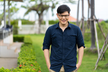 Portrait of Asian thai people with eye glasses outdoors