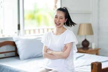 Young Asian woman feeling happy smiling. Portrait gorgeous woman at home