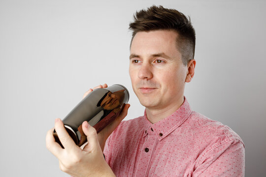 A Man In A Pink Shirt With A Shaker, Bartender.