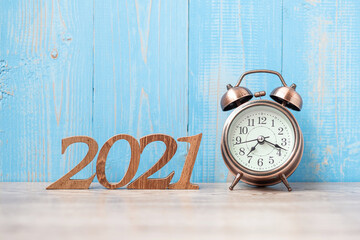 2021 Happy New Year  with retro alarm clock and wooden number. New Start, Resolution, Goals, Plan, Action and Mission Concept