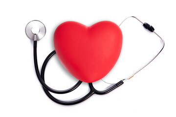 Health Care treatment concept - red heart shape with medical stethoscope on a white background