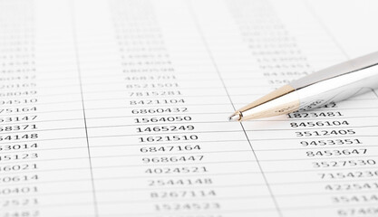 Pen with Financial accounting graphs. Finance, business and accounting concept.