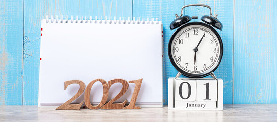 2021 Happy New Year  with blank notebook, black retro alarm clock and wooden number. New Start, Resolution, Goals, Plan, Action and Mission Concept