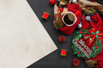 christmas decoration with hot coffee on black wooden background. flat lay. copy space for text.