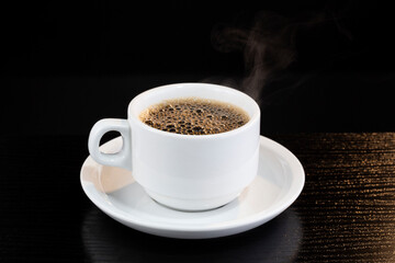 Hot black coffee served in a cup