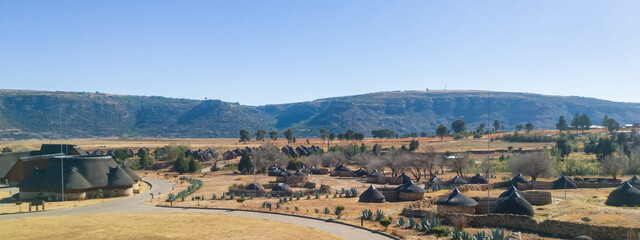 The traditional huts in Lesotho have a characteristic roof tops. These "hats" on the thatched roofs is also made as part of the country's flag.