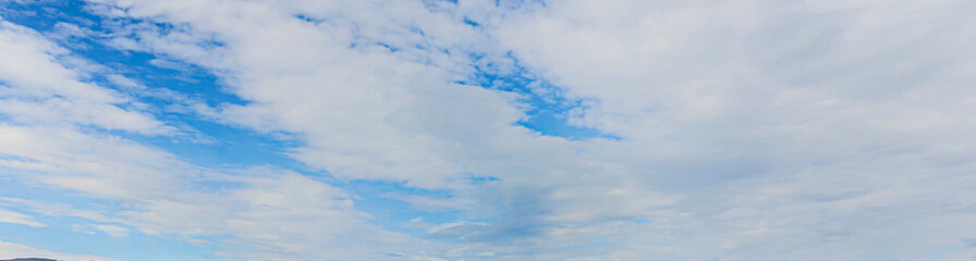 Image of a partly cloudy and partly clear sky during the day