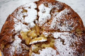 sweet pie in a plate cut into even pieces