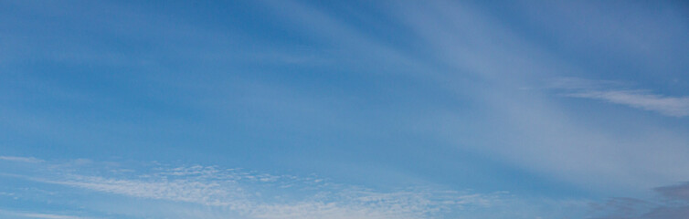 Image of a partly cloudy and partly clear sky during the day