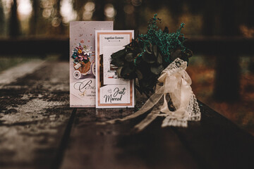 postcards and dried flowers on a wooden table