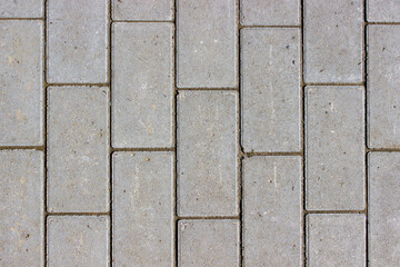 Clean newly layed grey rectangle pavement tiles background texture